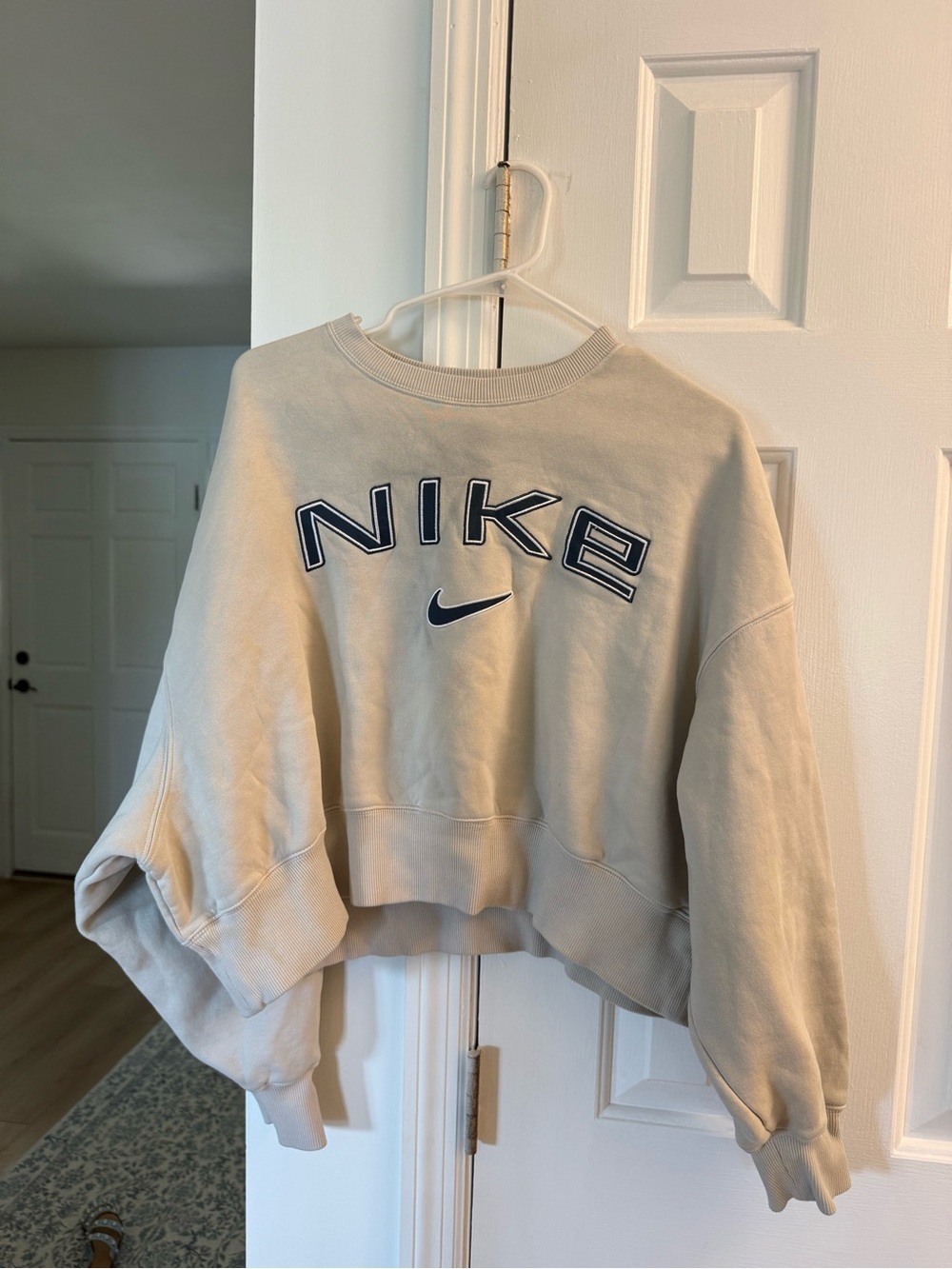 Nike Women's Beige Cropped Crewneck Sweatshirt with Navy Logo
